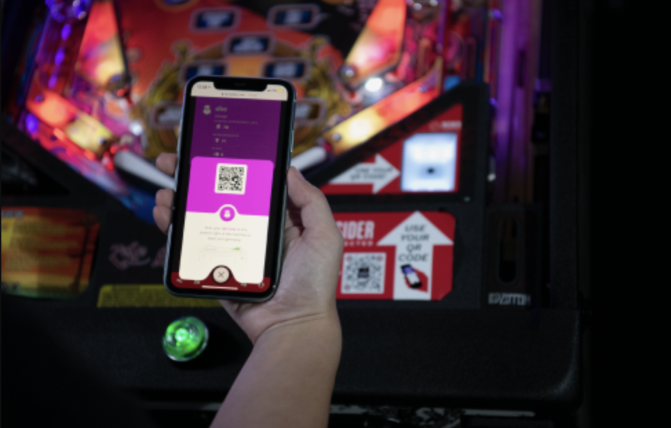 Player logging in to their Stern Insider Connected profile by scanning a pinball machine